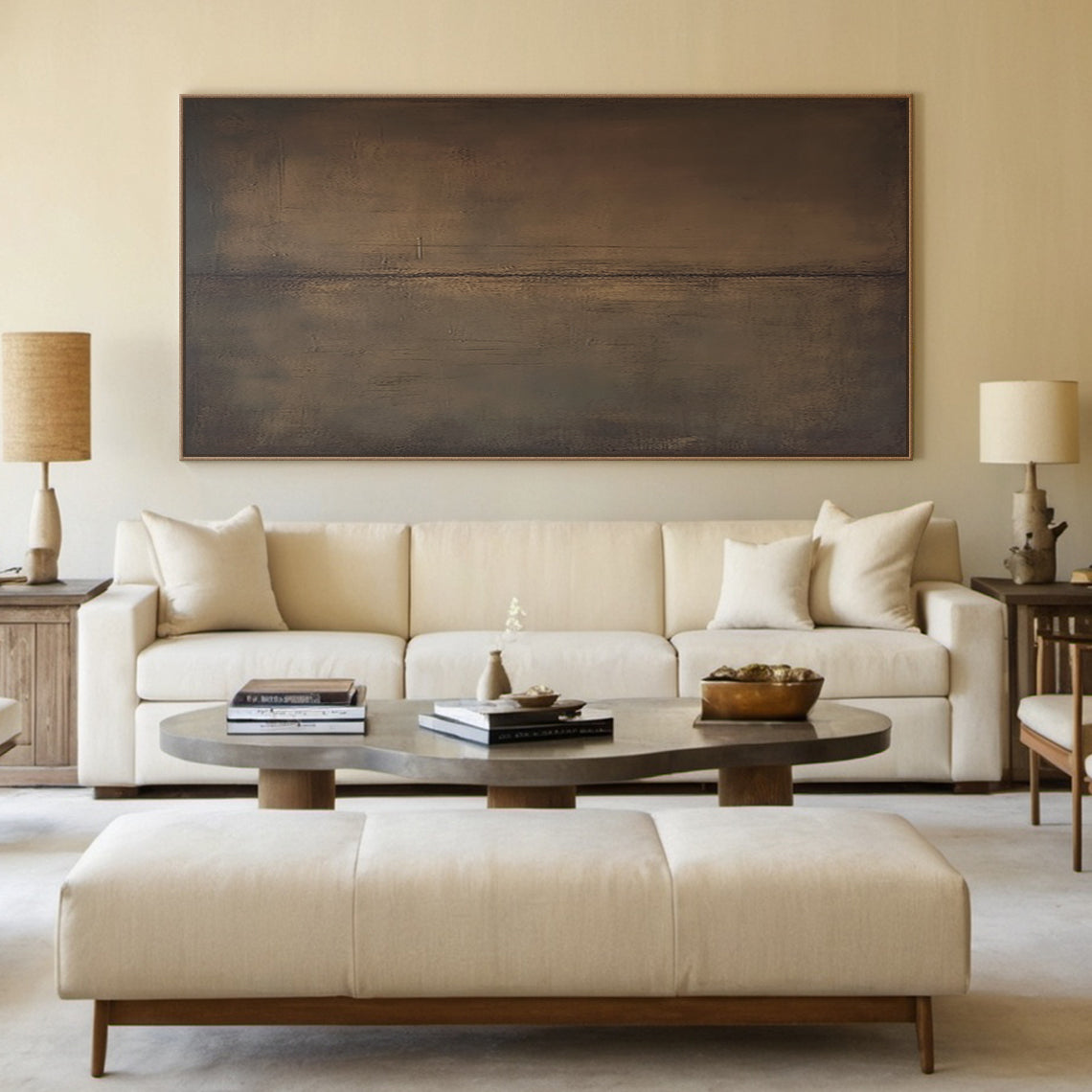 Wabi Sabi abstract wall art canvas (AURA188) with neutral brown and gray mottled tactile surface, hanging above a natural wood console table in a sunlit Japandi living room. The table displays a small potted succulent and a woven storage basket, with a linen cushion resting on a low wooden bench nearby. Soft natural light filters through sheer curtains, creating a serene earthy vibe perfect for a minimalist living space or entryway. This vertical abstract piece features organic uneven strokes and subtle war