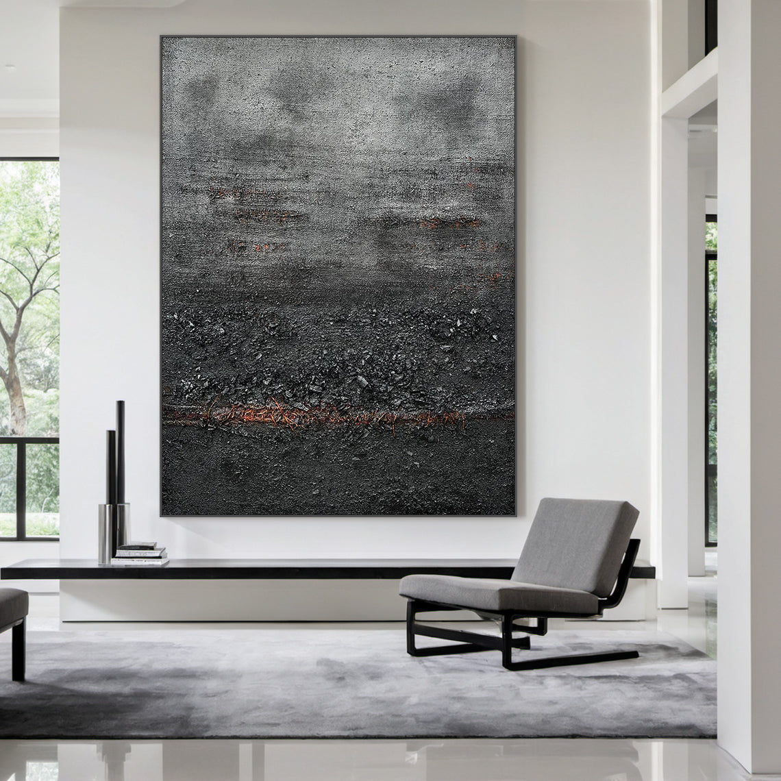 Wabi Sabi Abstract Impasto Canvas Art - Thick Tactile Charcoal Gray & Black Base with Soft Warm Terracotta Undertones. Displayed in Modern Minimalist Living Room Above Black Console Table, Complementing Neutral Japandi Decor & Gray Seating. Ideal for Serene Organic Interior Spaces Seeking Timeless, Textured Wall Accents.