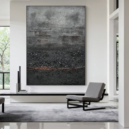 Wabi Sabi Abstract Impasto Canvas Art - Thick Tactile Charcoal Gray & Black Base with Soft Warm Terracotta Undertones. Displayed in Modern Minimalist Living Room Above Black Console Table, Complementing Neutral Japandi Decor & Gray Seating. Ideal for Serene Organic Interior Spaces Seeking Timeless, Textured Wall Accents.