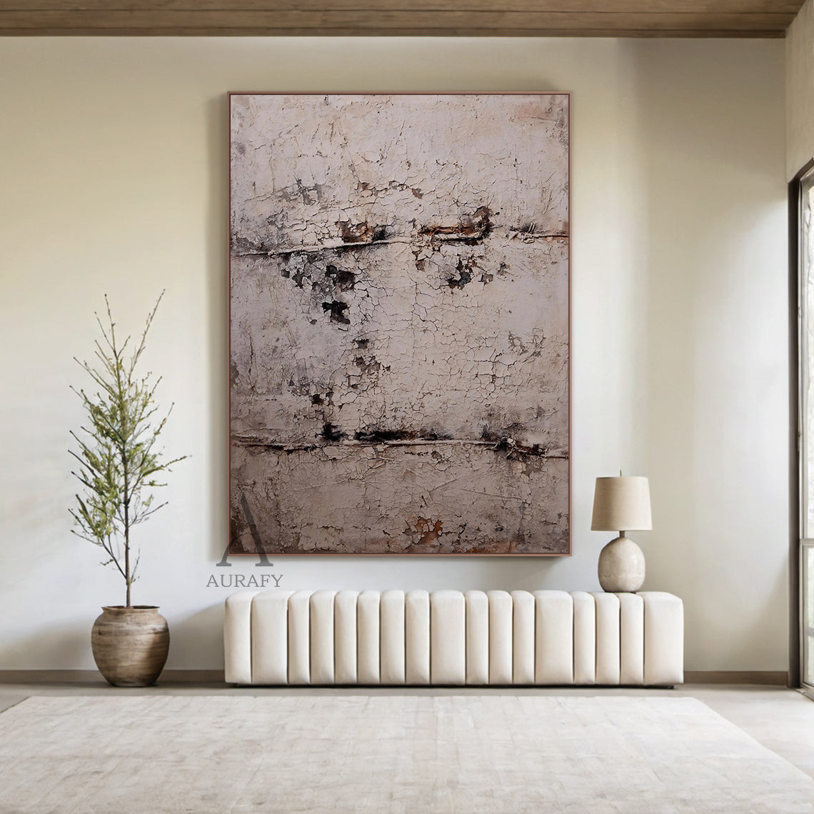 Large vertical abstract wall art with a textured, cracked surface in neutral beige, gray, and subtle brown/black tones, framed in a thin brown border. Displayed in a modern bedroom setting above a wooden nightstand, next to a white ceramic vase with green foliage and a small woven basket—ideal for minimalist or modern bedroom decor accents.