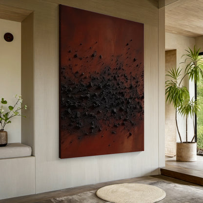 Wabi Sabi Handcrafted Textured Abstract Wall Art in Deep Red & Charcoal Black. High-Relief Plaster Surface with Organic Imperfections, Perfect for Serene Minimalist Bedrooms, Japandi Decor, or Cozy Home Nooks. Displayed Above Light Gray Bed Headboard in a Wabi Sabi Style Bedroom with Wooden Nightstands & Warm Glow Table Lamps. Ideal for Infusing Tactile Depth to Japandi Bedrooms or Minimalist Reading Corners, Embodying Wabi Sabi’s Celebration of Imperfect Beauty.