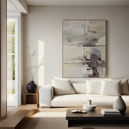 Wabi Sabi Abstract Textured Wall Art - Hand-applied impasto acrylic paint with thick, organic brushstrokes and palette knife texture. Neutral tones (beige, soft gray, off-white) with subtle pink accents, framed in natural wood. Displayed above a beige linen sofa in a bright living room, the raised texture catches natural light through sheer curtains—creating layered light and shadow effects that emphasize its tactile depth, perfect for minimalist/bohemian/Scandinavian decor. Also ideal for bedroom, ready to