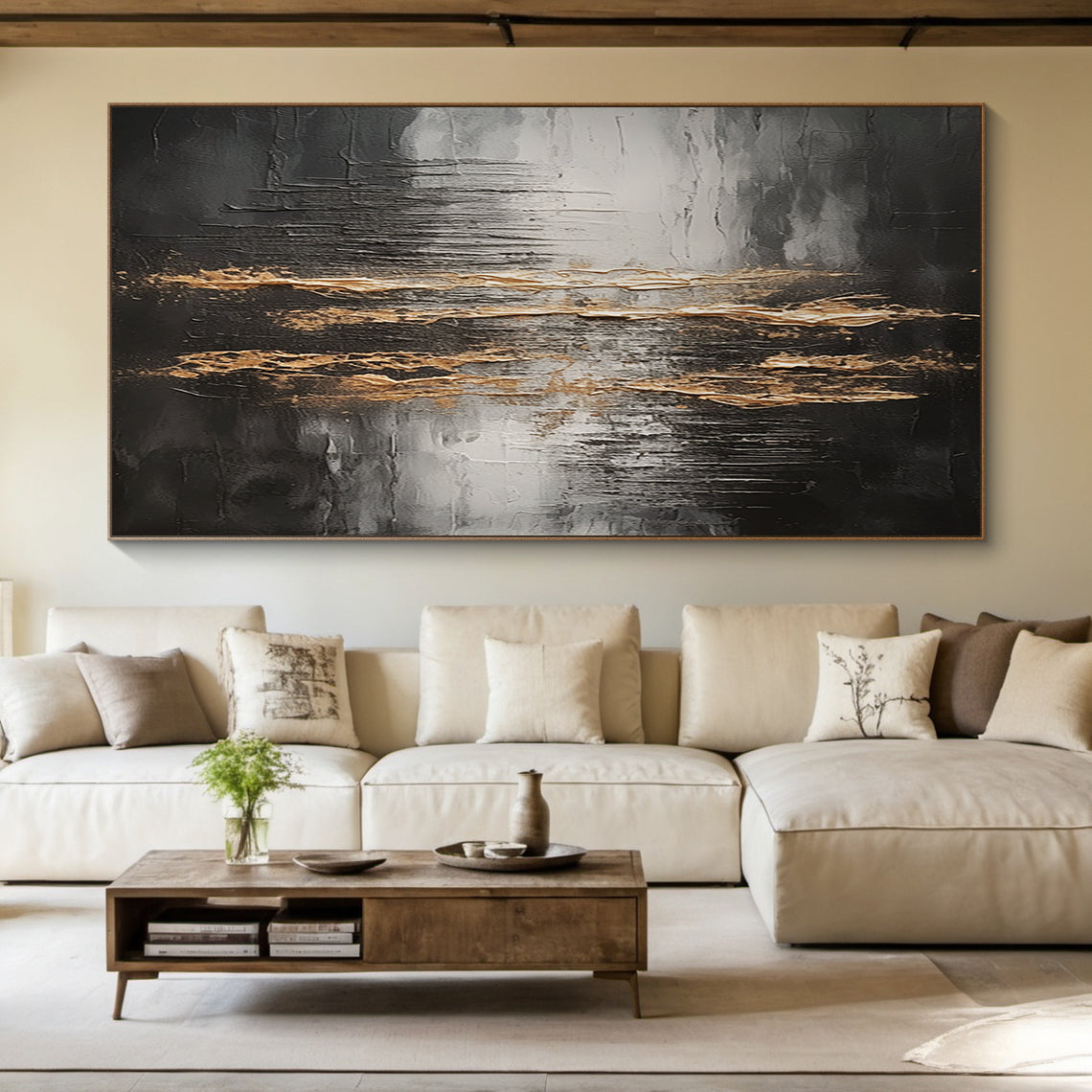 Wabi Sabi Abstract Impasto Wall Art with Thick Tactile Cracked Surface - Horizontal Canvas Above Beige Sectional Sofa in Serene Japandi Living Room. Black Gray White Base with Flowing Gold Accents, Handcrafted Imperfect Texture for Minimalist or Organic Modern Decor. Aura190 Artwork Focal Point for Neutral Living Space.