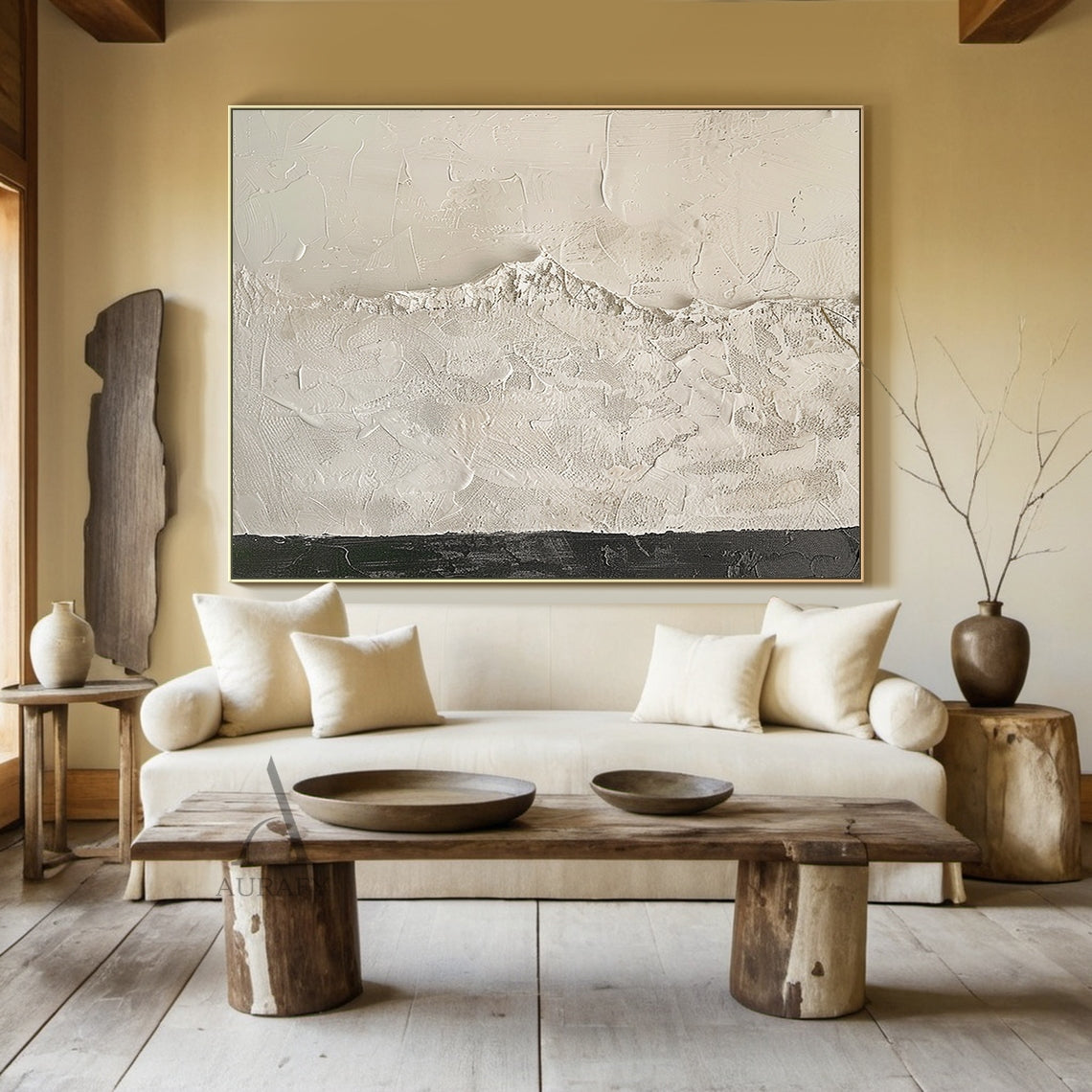 Beige wabi-sabi abstract textured canvas wall art, handcrafted with heavy impasto knife painting technique. The artwork is dominated by soft warm off-white and light beige tones, with smooth scraped impasto texture on the upper section, rough granular mountain-like raised texture in the middle that faintly reveals canvas grid, and a narrow deep charcoal textured band at the bottom to balance the visual weight. It is a minimalist Japandi style abstract piece suitable for neutral home interior decoration.
