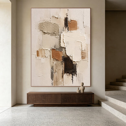 Wabi-sabi Japandi minimalist 3D textured abstract painting displayed in neutral home space, handcrafted with thick impasto techniques, features irregular geometric paint blocks in soft muted earth tones: warm beige, creamy off-white, rustic terracotta brown, deep chocolate brown, and understated cool gray. The artwork boasts mixed tactile textures of rough granular gritty patches, smooth raised palette knife strokes, and natural uneven cracked paint edges, bringing a calm, laid-back organic vibe that comple