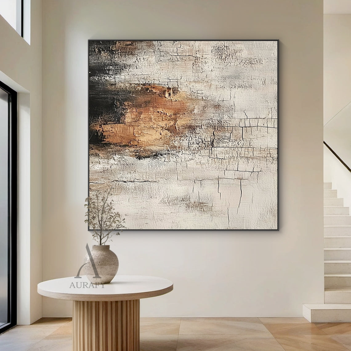 Abstract textured Wabi-sabi wall art (AURA636), features hand-applied cracked plaster texture with thick rough paint finish, light beige as base tone, warm brown color block sits on middle left as visual focus, dark gray near black gradient at top left, non-figurative abstract composition, presents weathered aged vintage serene vibe, fits Japandi minimalist living room, bedroom, entryway neutral organic home decoration.