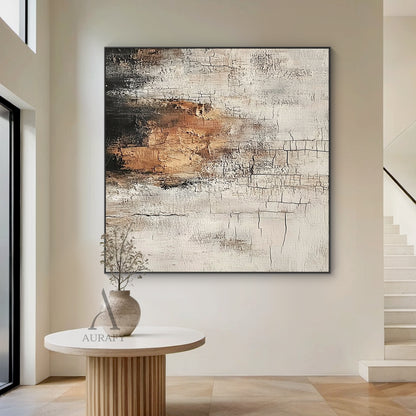 Abstract textured Wabi-sabi wall art (AURA636), features hand-applied cracked plaster texture with thick rough paint finish, light beige as base tone, warm brown color block sits on middle left as visual focus, dark gray near black gradient at top left, non-figurative abstract composition, presents weathered aged vintage serene vibe, fits Japandi minimalist living room, bedroom, entryway neutral organic home decoration.