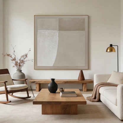 Square Wabi-Sabi beige general abstract canvas wall art AURA737, full-coverage rough sandy impasto textured surface with subtle canvas grain, split into 4 soft-transition neutral beige tonal blocks (bright warm off-white, pale sand, light taupe, muted warm beige), bottom left block with soft curved edge, finished with matching narrow beige border, minimalist Japandi luxe neutral home decor artwork for calm interior spaces.