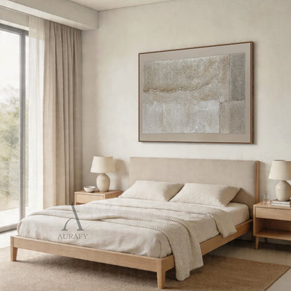 Wabi-Sabi beige plaster textured abstract canvas wall art (AURA735) interior wall mounted scene display, with the artwork in horizontal landscape orientation. Features a full muted warm earth tone palette of light tan beige, cream off-white, grey beige and soft taupe. Hand-applied 3D impasto surface has two undulating raised horizontal ridges dividing the canvas into 3 sections with varying granular texture, plus vertical straight split blocks and small raised texture accents on the right, mimicking natural