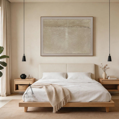 Wabi-Sabi Beige Handmade Textured Abstract Canvas Wall Art AURA734. Styled residential scene display of the horizontal abstract artwork, featuring warm beige grainy impasto central panel, natural fine crackle textures across the surface, a thin irregular dark horizontal crack splitting the panel, bordered by soft pale off-white smooth frame, shown hung above a light oak sideboard against a muted off-white wall matched with linen soft furnishings as neutral tactile Japandi minimalist decor, ideal for adding 