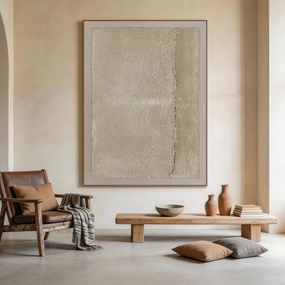 Wabi-Sabi Beige Handmade Textured Abstract Canvas Wall Art AURA734. Horizontal general abstract artwork with warm beige grainy impasto central panel, natural fine crackle textures across the surface, a thin irregular dark horizontal crack splitting the panel, bordered by soft pale off-white smooth frame. Neutral tactile Japandi minimalist wall decor for calm curated residential spaces.