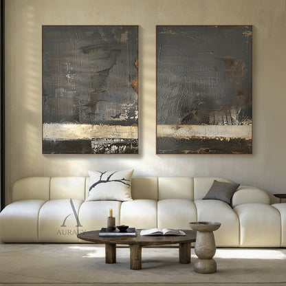 2 piece Wabi Sabi black abstract hand painted impasto canvas wall art set, diptych featuring deep charcoal black textured thick palette knife stroke base, weathered cracked muted beige horizontal strip with subtle aged brown flecks, hung above a solid reclaimed wood dining table with linen cushion seats in a warm earth toned rustic modern dining room, fits minimalist, Japandi, earth toned and quiet luxury home interiors.