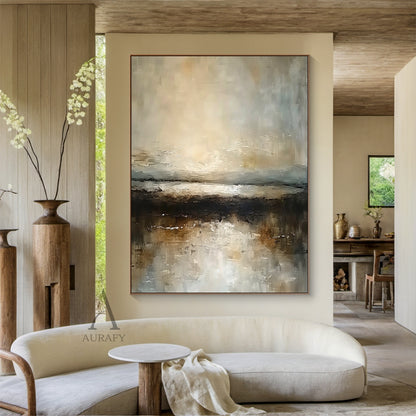 Wabi-Sabi brown abstract landscape impasto canvas artwork AURA742, textured abstract painting of hazy misty shoreline, upper section with soft blended warm beige, sun-kissed gold and pale gray blocks simulating dawn/dusk misty sky, middle textured gray layer with subtle light-reflecting strokes mimicking open water surface, lower deep brown and umber thick impasto blocks as dark shore bank, muted earthy color palette with subtle metallic flecks, suited for Japandi minimalist luxe neutral interiors.