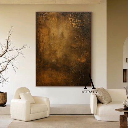 Wabi Sabi Brown Plaster Textured Weathered Canvas Art (AURA568) - Layered earthy brown hues (light gold, warm caramel, deep chocolate), distinct canvas weave texture, rough organic plaster finish, subtle chipped edges in natural spots, faint "AURAFY" logo at bottom right corner. Ideal bohemian entryway statement piece, Scandinavian home office wall decor, or neutral-toned reading nook accent—embracing Wabi Sabi’s celebration of imperfection and timeless beauty to infuse calm, grounded vibes into any interio
