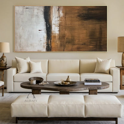 Handcrafted wabi sabi Japandi beige abstract textured canvas wall art real home hanging display, with hand-applied impasto finish mimicking weathered aged plaster. Its upper section is warm light apricot beige, lower section is cool pale greyish off-white, divided by a rough dark charcoal horizontal line, covered with natural random fine cracks, uneven granular textures and mottled distressed details, the minimalist neutral decorative artwork adapts to all kinds of home decor styles perfectly.