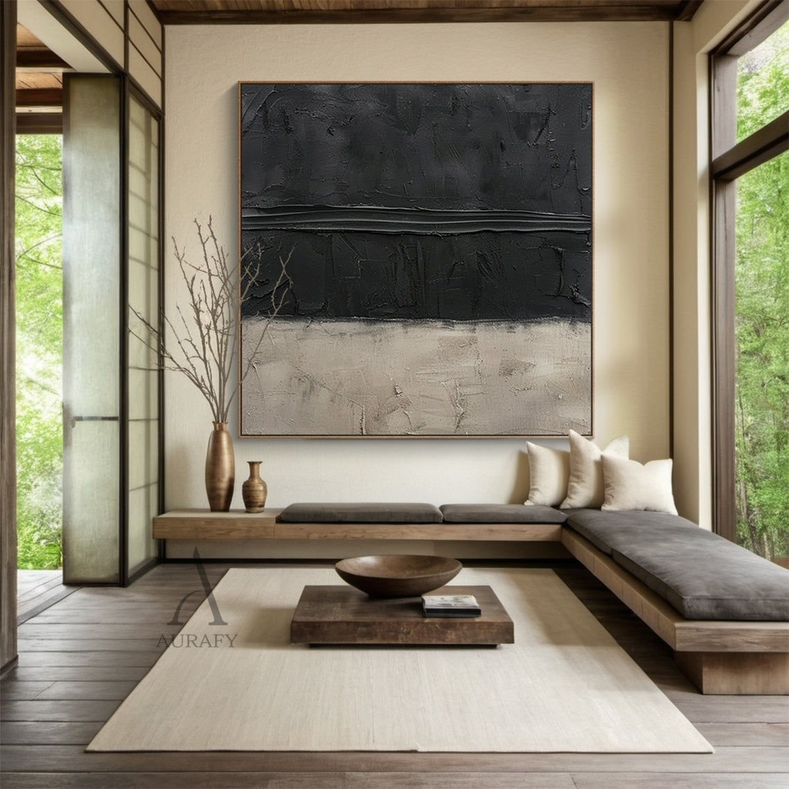 Handcrafted wabi-sabi Japandi abstract canvas artwork (AURA797), featuring a two-tone muted neutral palette of deep matte black and soft warm beige. The piece uses thick hand-applied impasto technique: upper black areas have scored, scraped pigment textures with a prominent raised horizontal impasto stripe across the middle, lower beige section has plaster-like aged, scratched, faded uneven surfaces. Minimalist textured abstract wall art for modern, minimalist, neutral industrial and Japandi home decor.