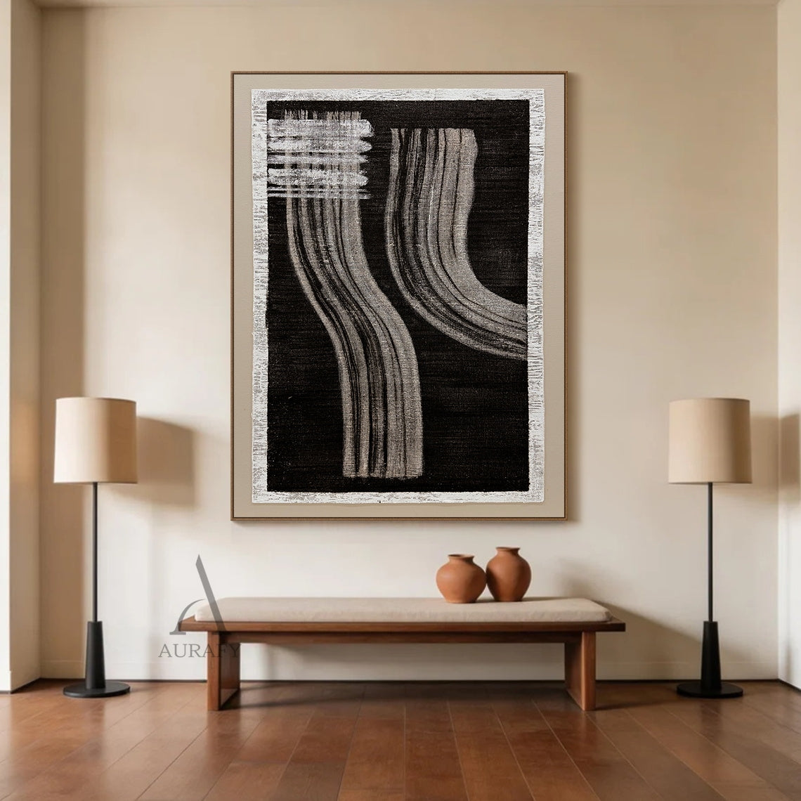 Wabi-Sabi black gray abstract textured wall art displayed in warm light-wood Japandi dining scene, handcrafted on rough woven canvas with raw off-white frayed border. Boasts deep black backdrop, horizontal gray brush stroke blocks at upper left, two groups of soft flowing curved gray draping linear strokes with natural hand-painted texture, this minimalist monochrome Japandi artwork is perfect for dining room, study and corridor warm neutral interior decor.