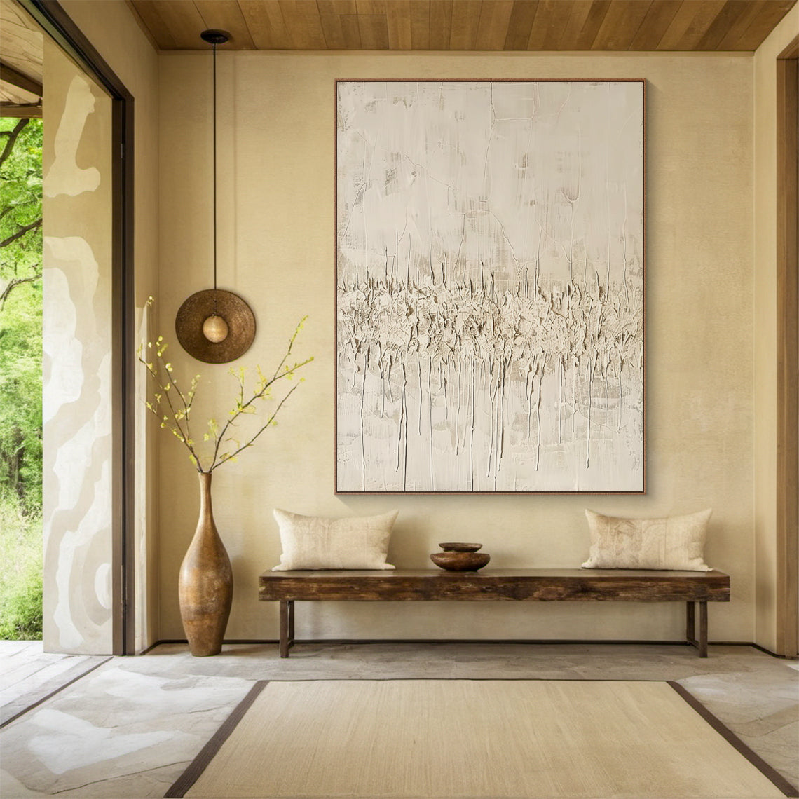Vertical Wabi Sabi Abstract Art (AURA205) with 3D tactile plaster texture—thick impasto strokes, natural drips, and rough organic texture in neutral beige, off-white, and light brown tones. Displayed in a cozy bohemian bedroom with macramé wall hanging, rattan bed frame, and soft linen bedding, embodying the serene, organic Wabi Sabi aesthetics.