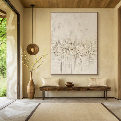 Vertical Wabi Sabi Abstract Art (AURA205) with 3D tactile plaster texture—thick impasto strokes, natural drips, and rough organic texture in neutral beige, off-white, and light brown tones. Displayed in a cozy bohemian bedroom with macramé wall hanging, rattan bed frame, and soft linen bedding, embodying the serene, organic Wabi Sabi aesthetics.