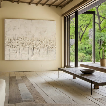 Vertical Wabi Sabi Abstract Art (AURA205) with 3D tactile plaster texture—thick impasto strokes, natural drips, and rough organic texture in neutral beige, off-white, and light brown tones. Displayed in a cozy bohemian bedroom with macramé wall hanging, rattan bed frame, and soft linen bedding, embodying the serene, organic Wabi Sabi aesthetics.
