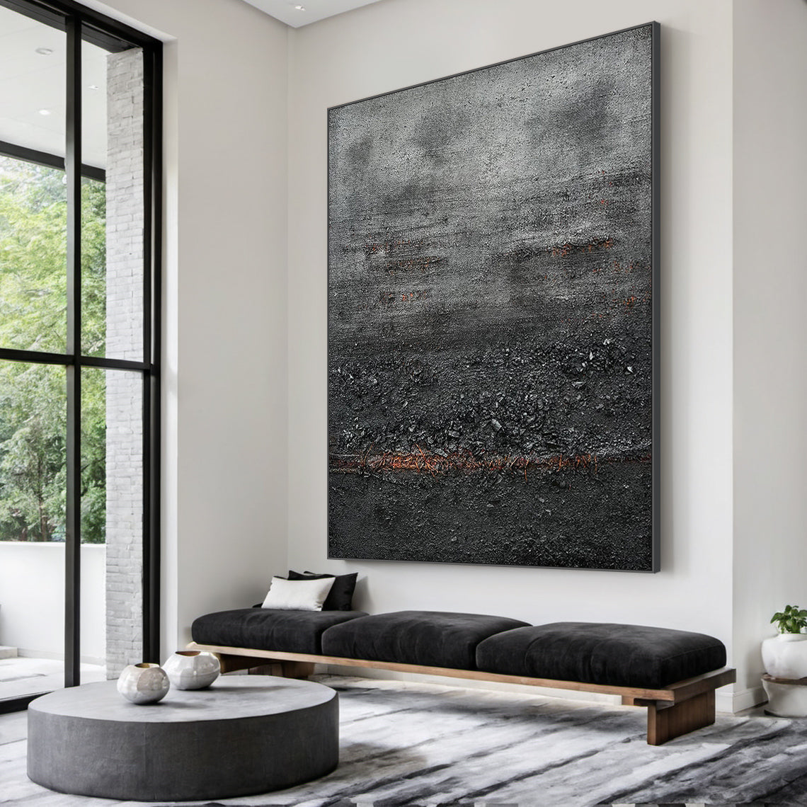Wabi Sabi Abstract Impasto Canvas Art - Thick Tactile Charcoal Gray & Black Base with Soft Warm Terracotta Undertones. Displayed in a Serene Wabi-Sabi Living Room Above a Natural Wood Media Console, Complementing Linen Sofa, Woven Jute Rug, Handcrafted Ceramic Decor Pieces, and Soft Floor Lamp. Ideal for Calm Organic Living Spaces Seeking Timeless, Textured Wall Accents That Elevate Cozy, Earthy Ambiance.