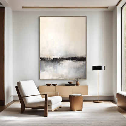 Wabi Sabi Pink-Inspired Tactile Plaster Wall Art AURA183: Vertical Abstract Canvas with Warm Beige Upper Section, Black Horizontal Band, and Light Gray Textured Lower Area. Hand-Applied Plaster Texture for Organic Minimalist Aesthetic. Displayed as Focal Point in Japandi Living Room, Complementing White Armchair, Wooden Console, and Neutral Decor. Serene Vibe for Modern Home Interiors.