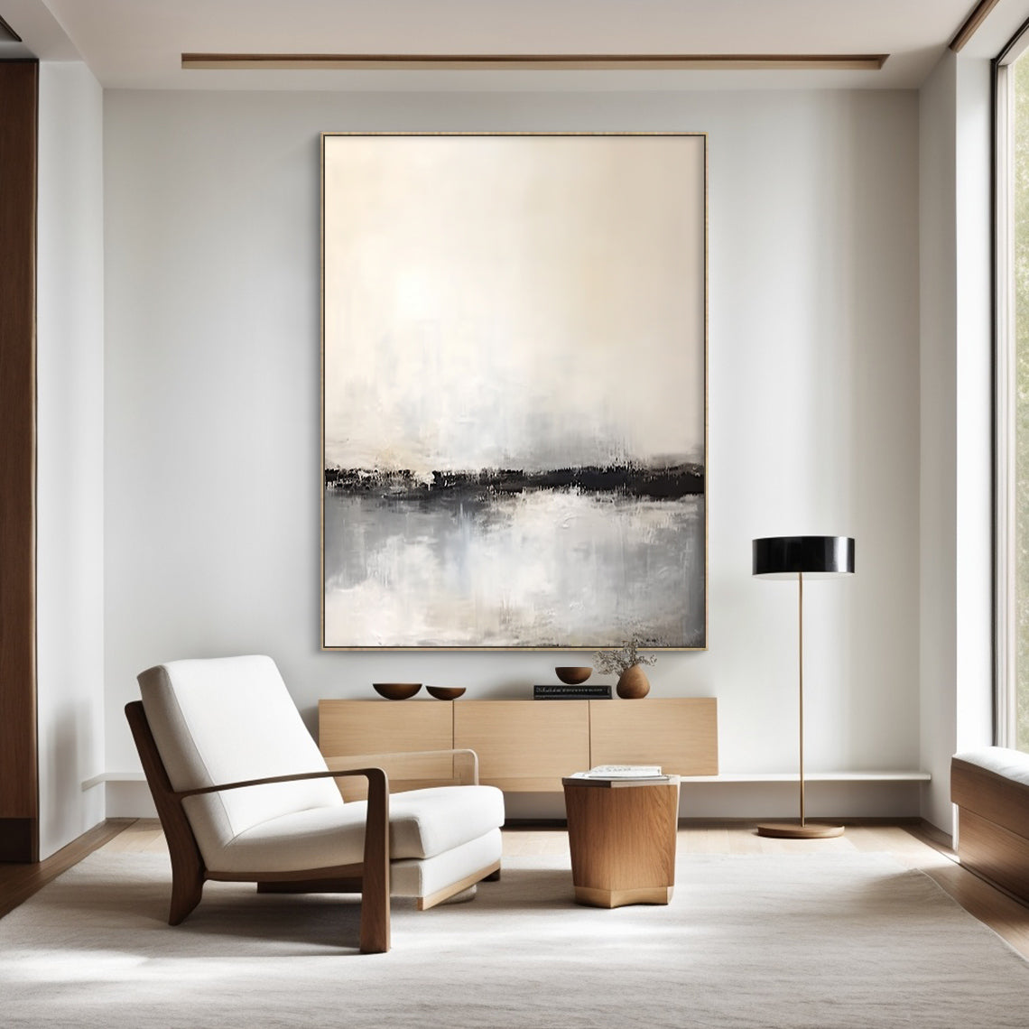 Wabi Sabi Pink-Inspired Tactile Plaster Wall Art AURA183: Vertical Abstract Canvas with Warm Beige Upper Section, Black Horizontal Band, and Light Gray Textured Lower Area. Hand-Applied Plaster Texture for Organic Minimalist Aesthetic. Displayed as Focal Point in Japandi Living Room, Complementing White Armchair, Wooden Console, and Neutral Decor. Serene Vibe for Modern Home Interiors.