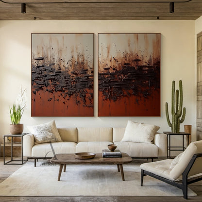 2 piece wabi sabi abstract textured canvas wall art set, diptych painting featuring warm terracotta red base, layered deep brown thick impasto plaster texture, soft muted beige upper gradient. This sculpted earth-tone wall art is hung on the soft warm oat-colored plaster wall above a low-platform solid pine bed in a calming minimalist wabi sabi bedroom, perfectly coordinating with matte clay table lamps, woven rattan bedside stools and linen duvet cover home decor.