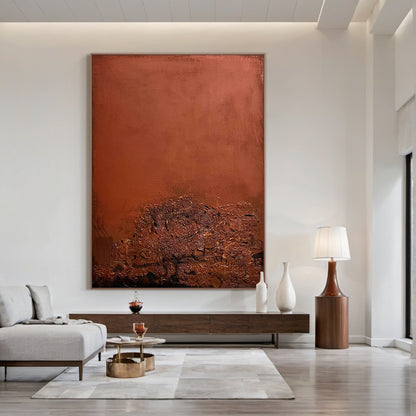 AURA222 Wabi Sabi Red Textured Abstract Wall Art: Large vertical handcrafted canvas with layered impasto textures and organic imperfections, displayed in a modern minimalist living room above a wooden console table. Rich warm red tones and tactile details complement neutral decor (light gray sofa, white vases), serving as a focal statement piece for living room decor. This abstract art embodies Wabi Sabi charm with subtle depth variations, ideal for elevating contemporary home spaces.  