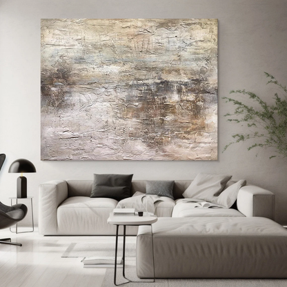 Wabi Sabi Abstract Art AURA217 - Hand-painted high-relief plaster wall decor with soft muted pink and warm neutral tones (beige, taupe, light gray). Hung on a light gray wall beside a wooden dining table in a minimalist dining area, highlighting its tactile uneven texture with thick brushstrokes and intentional imperfections. Ideal for Japandi living rooms, entryways, or modern organic spaces, complements gray walls, wood accents, and smooth surfaces.
