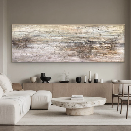 Wabi Sabi Abstract Art AURA217 - Hand-painted high-relief plaster wall decor with soft muted pink and warm neutral tones (beige, taupe, light gray). Hung on a warm beige wall above a low wooden coffee table in a cozy Japandi living room, showcasing its tactile uneven texture with thick brushstrokes and intentional imperfections. Ideal for Japandi living rooms, entryways, or modern organic spaces, complements neutral walls, wood accents, and soft linen furniture.